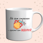 Photo of a cup with a funny zodiac design for aquarius on an orange background