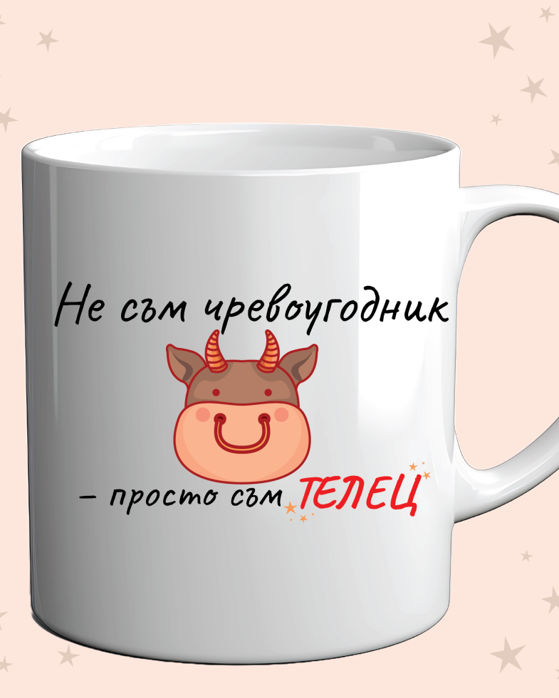 Photo of a cup with a funny zodiac design for taurus on an orange background