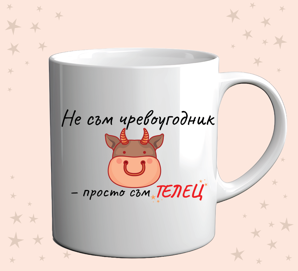 Photo of a cup with a funny zodiac design for taurus on an orange background