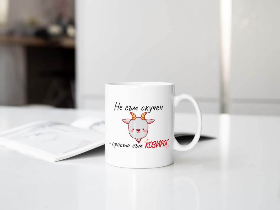 Photo of a cup with a funny zodiac design for capricorn on a white kitchen board